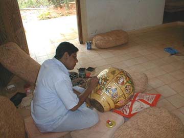 Ganeson at work at the Burmese pot