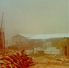 The temporary 'Toujours Mieux' (now called 'Aureka'), here in a dust storm season, became the second site for Pour Tous.