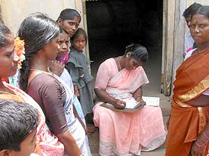 AVAG development worker helping the villagers