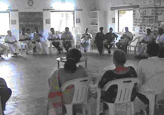 AVAG's Anbu, Karin and Moris talking to the village leaders