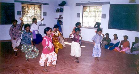 Children make use of the spacious new hall to show off their talents.