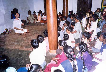 Aurelio leads the children into exercises with voice, gestures and mime
