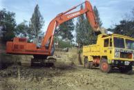 Excavation equipment from Auroville's Water Harvest service deepening Annapurna's pond