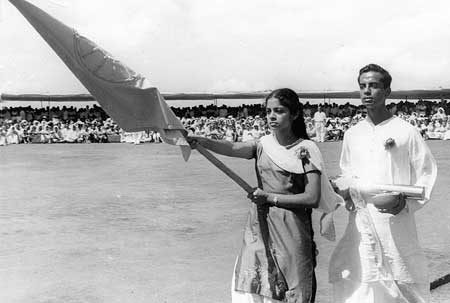 Kiran Poddar (left) carrying Mother's flag and Vijay Poddar with the stainless steel container with Auroville's Charter