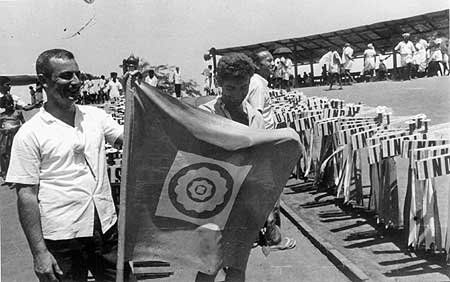 The flag of Auroville and some of the plackards of the participating countries and states of India