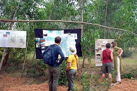 Participants viewing area maps and other exhibits before the walk