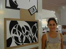 Djenane next to her black and white study of an athletic shoe