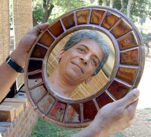 A mirror encircled by tiles, shown by Angad, is one of the many new products of Mantra.