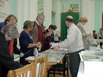 Russians and Aurovilians exchanging information material