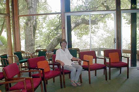 Aurovilian Tine, coordinator between Auroville and AVI, trying out seating arrangements in the main ‘Las Olas’ meeting place
