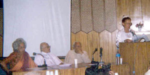 On the left, Dr. Aster Patel from Auroville; Ganga Lakshmi, right, reading  from the Mother's Agenda