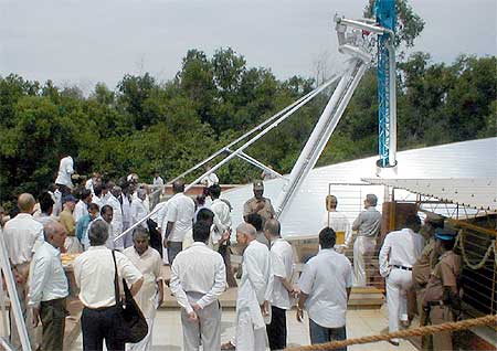 VIPs, Aurovilians and press folk admiring one of the largest solar collectors of its kind in the world..