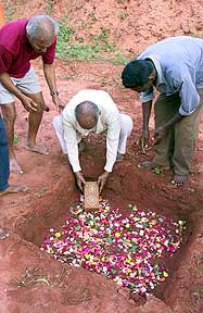 An older generation, Sri Nirodbaran of the Sri Aurobindo Ashram, laying the first stone...