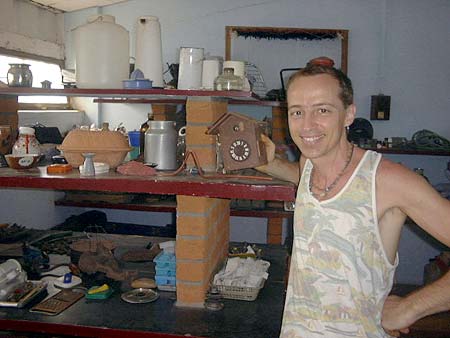 Olivier, the founder of MahaSaraswati Freestore, here with some of the products he collects and repairs, for further use by Aurovilian residents as well as the residents of the villages surrounding the township.
