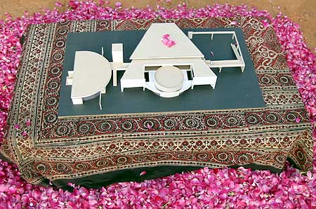 The maquette of the future Unity Pavilion proudly sat through the ceremony, surrounded by rosepetals..